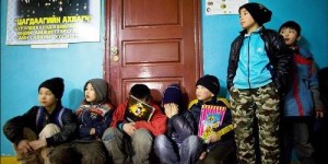 Mongolian street children wait in line to get registered at a child detention center March 11.