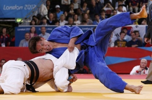 Germany's Ole Bischof fights with Kazakhstan's Islam Bozbayev in men's -81kg elimination judo match at London 2012 Olympic Games