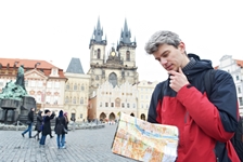 man with map over tourist attraction