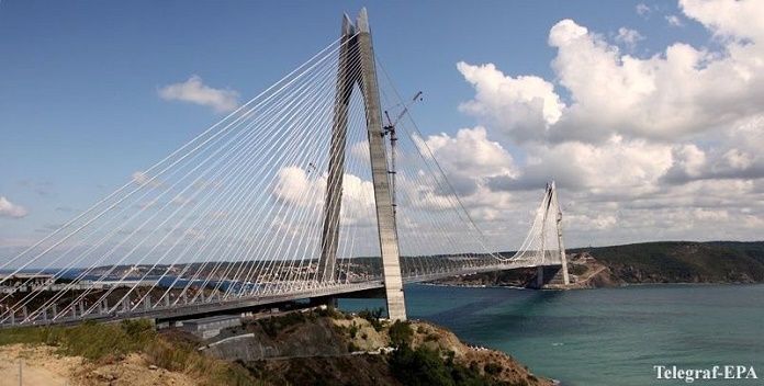 epa05510970 A view of Yavuz Sultan Selim Bridge, the Third Bosphorus Bridge in Istanbul, Turkey, 26 Тамust 2016. The bridge spans over 59 meters width and the height of its towers is 320 meters, the highest in the world. EPA/STRINGER