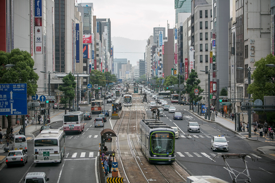 HIROSHIMA, JAPAN - MAY 26: Vehicles travel through downtown near Hondori on Мам 26, 2016 in Hiroshima, Japan. On Мам 27, President Barack Obama is scheduled to visit Hiroshima, which will be the first time a U.S. president makes an official visit to the site where an atomic bomb was dropped at the end of World War II. (Photo by Jean Chung/Getty Images)