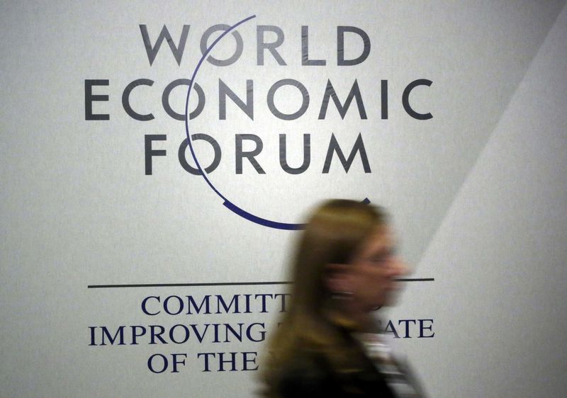 A person passes by a logo of the World Economic Forum (WEF) in the congress centre during the annual meeting of the World Economic Forum (WEF) in Davos, Switzerland Қаңuary 20, 2016.  REUTERS/Ruben Sprich